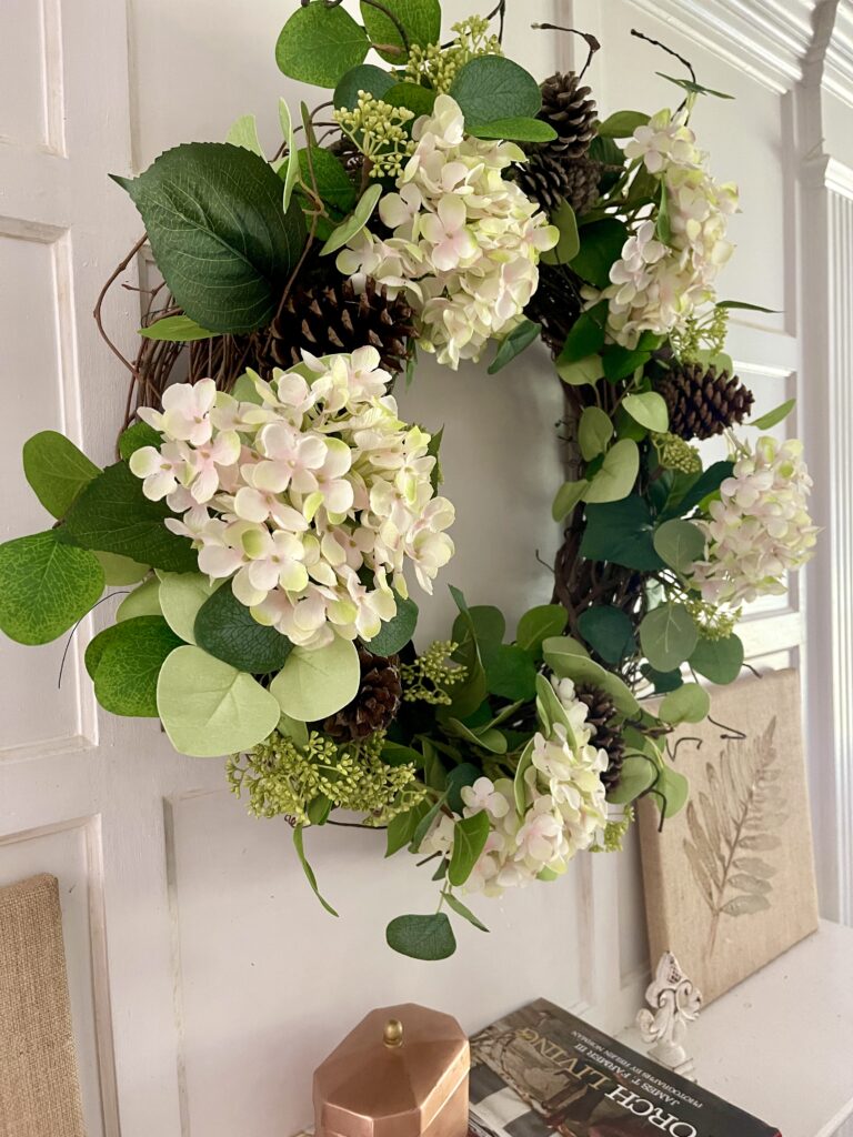 side view of hydrangea with pine cones wreath