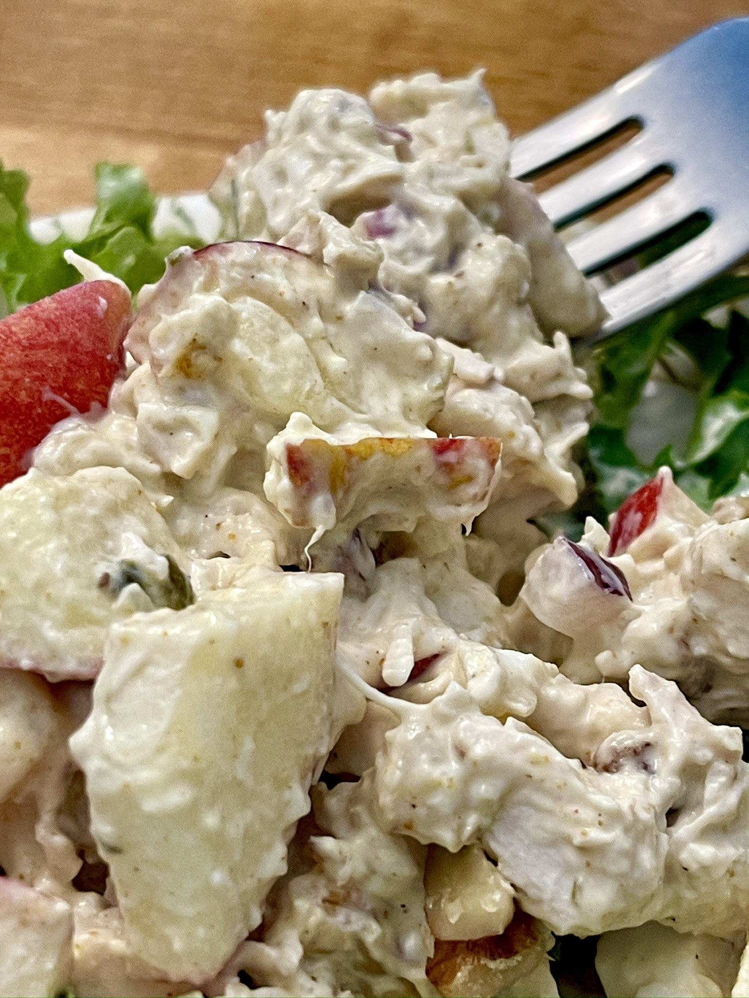 fall apple chicken salad on a fork