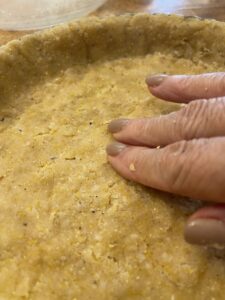 press tomato tart crust into a tart pan