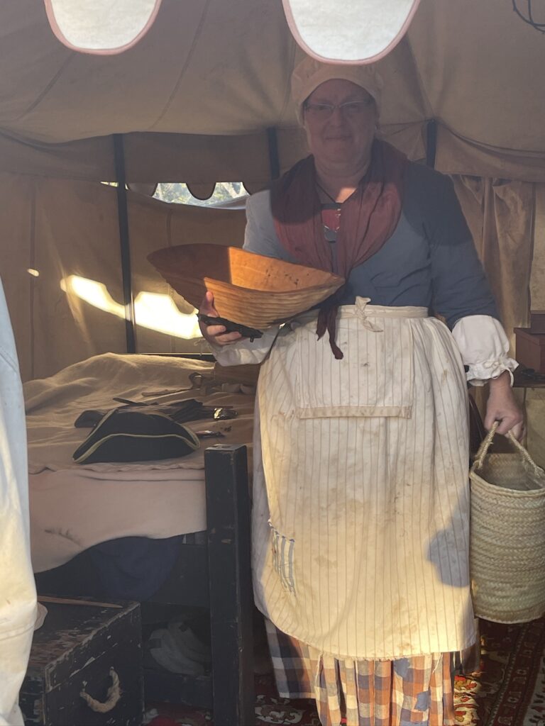 inside an encampment tent with a bed