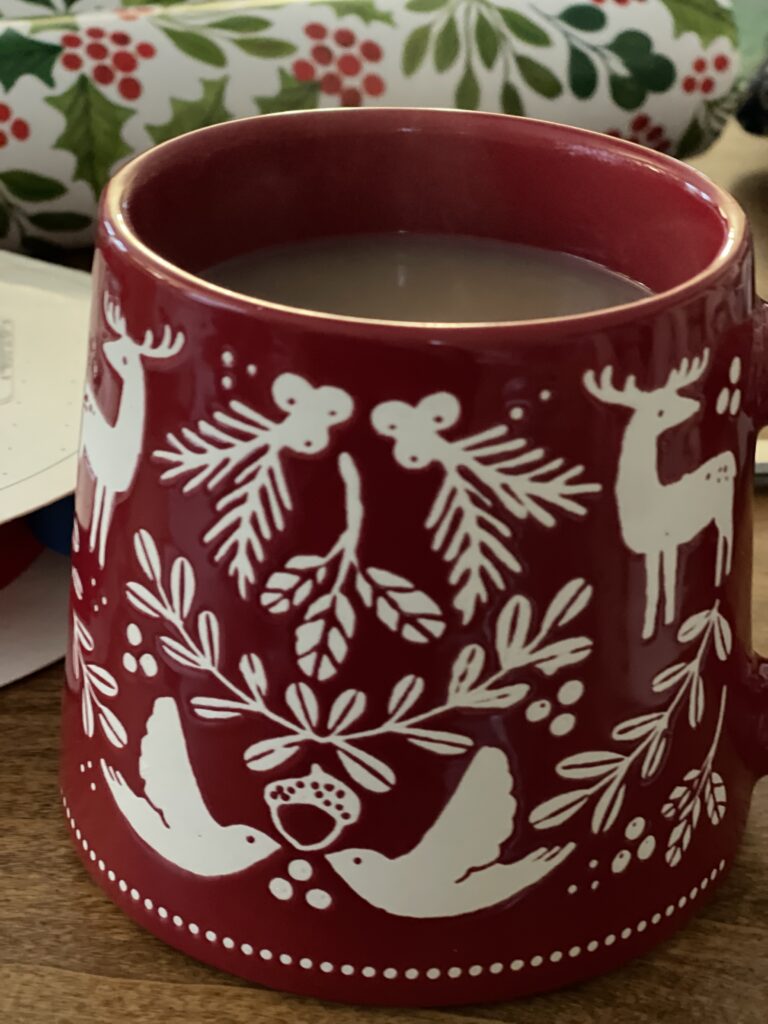 red Christmas mug with tea