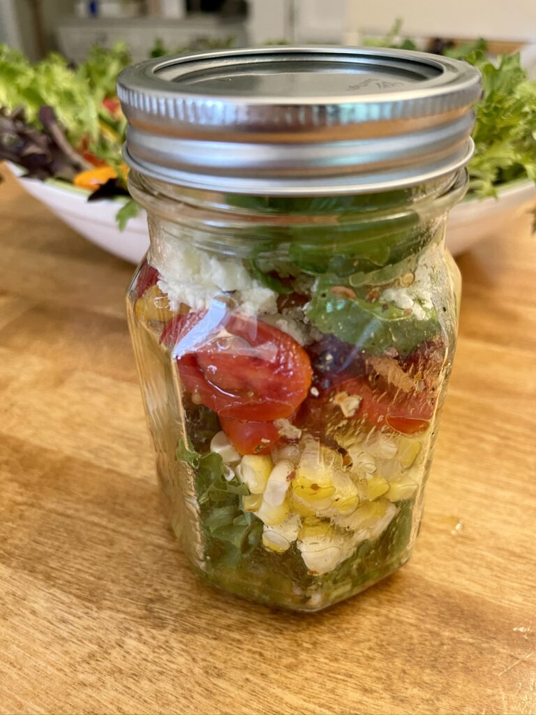 summer grilled chicken salad with bacon dressing in a jar