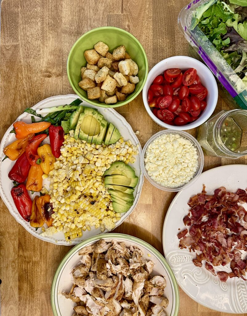 Prepped summer grilled chicken salad ingredients