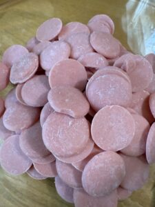 pink candy melts to melt and add for erasers for pencil cookies.