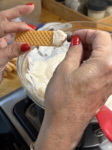 add a chocolate chip with curl to the back to form the pencil lead for the pencil cookies.