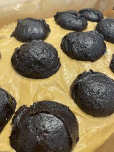 dollops of brownie mixture added to top of pumpkin cream cheese filling