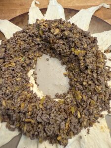 Meat mixture added to taco ring