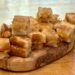 grilled cheese croutons on wooden board