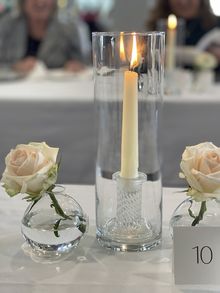 flowers and candles for the mystery dinner