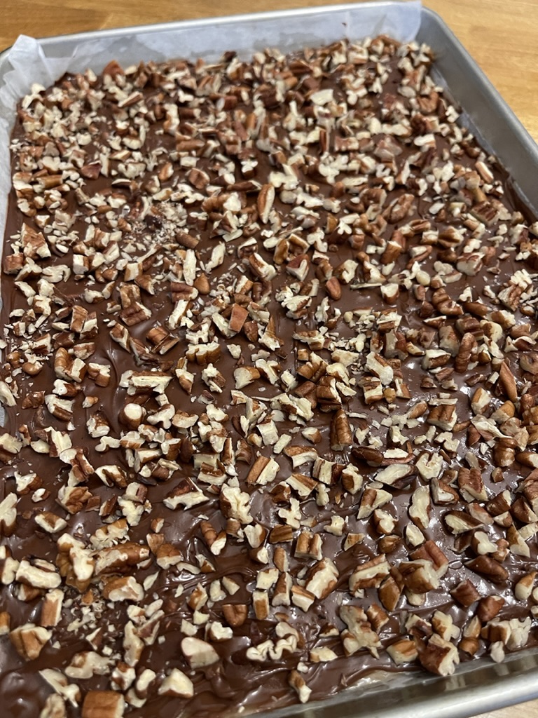 layer of pecans over toffee and chocolate