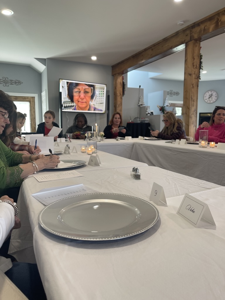 filling out the menus for the mystery luncheon