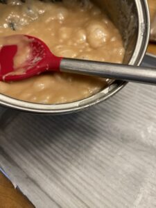 Pouring toffee into baking sheet