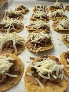 tiny tacos added to baking sheet