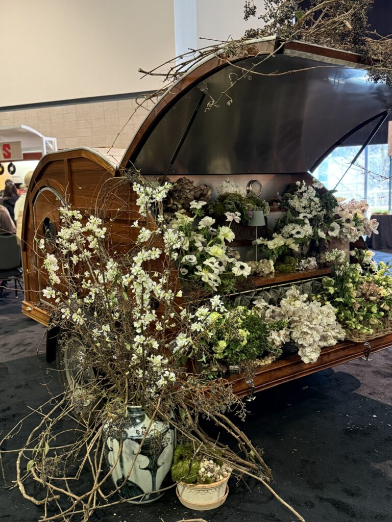 camper decorated with flowers at the 2026 Antiques & Garden show of Nashville