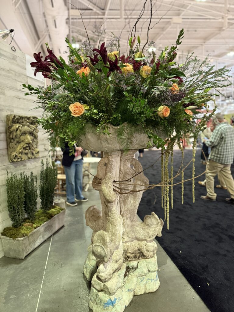 huge fish centerpiece filled with florals in vendor area