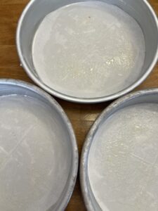 prepped cake pans for carrot cake