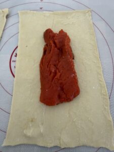 add one salmon fillet into a rectangle of puff pastry