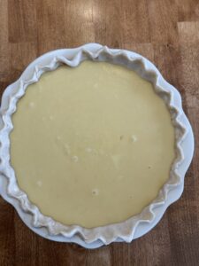 add lemon buttermilk pie filling to unbaked crust