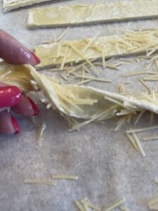 twist bread sticks coated with butter and Parmesan