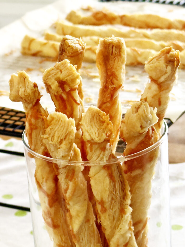 Parmesan bread sticks served in a glass