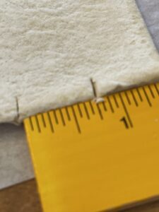 marking puff pastry to cut for Parmesan Bread Sticks