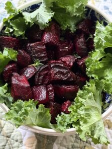 roasted beets in bowl with fresh kale