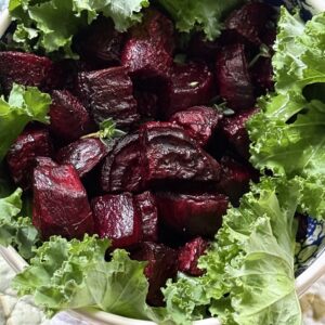 roasted beets in bowl with fresh kale
