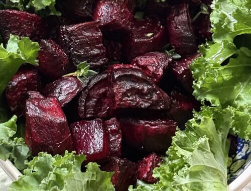 roasted beets in bowl with fresh kale