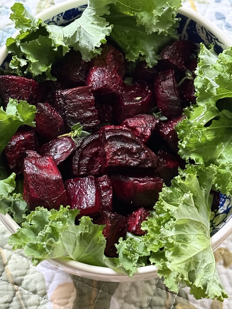 roasted beets in bowl with fresh kale