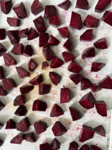 add seasoned beets on parchment lined baking sheet
