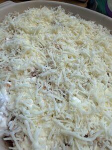 mozzarella cheese added to top of rotini lasagna