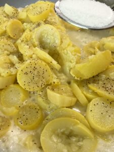 season yellow squash with salt, pepper, and sugar