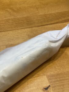 roll butter in roll with parchment paper