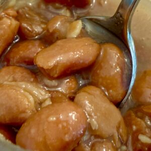Spoon in jar of chili pinto beans