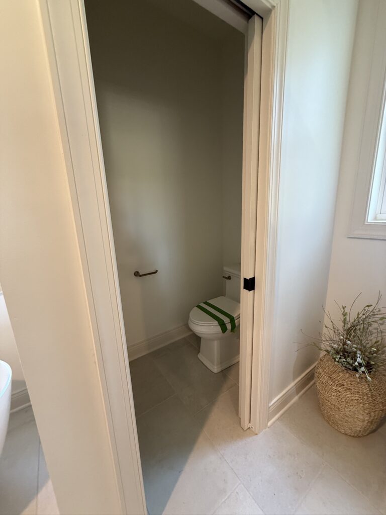 commode room in the primary suite bathroom