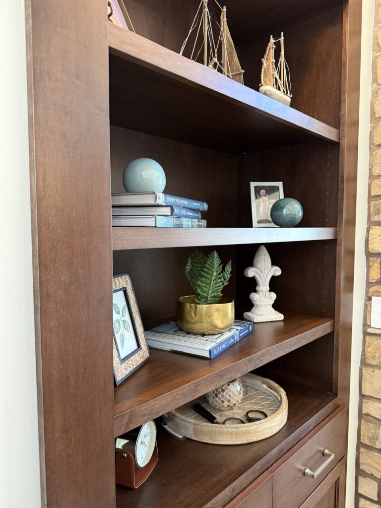 Accessories on bookshelves in living area