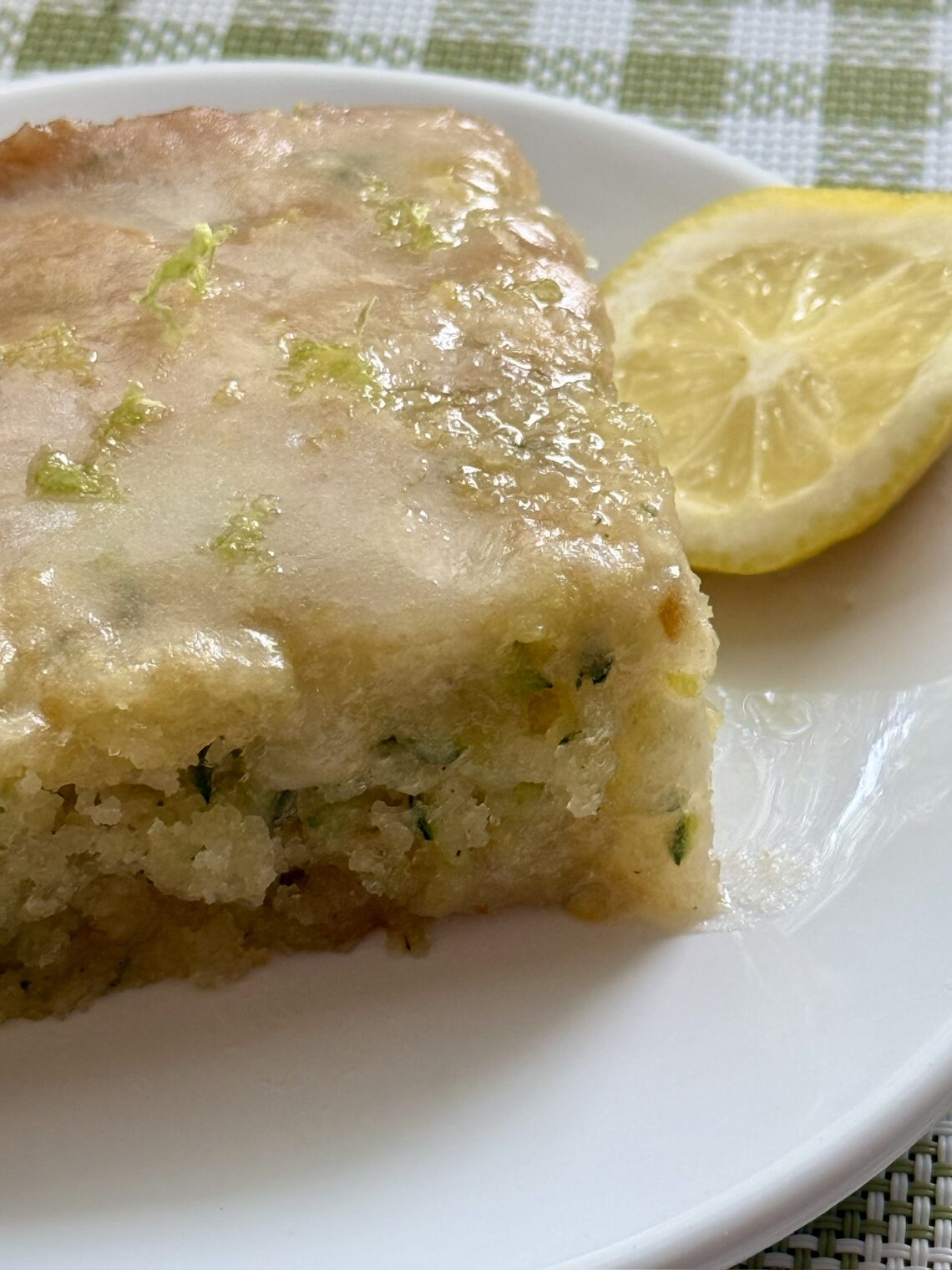 Glazed Lemon Zucchini cake on a plate