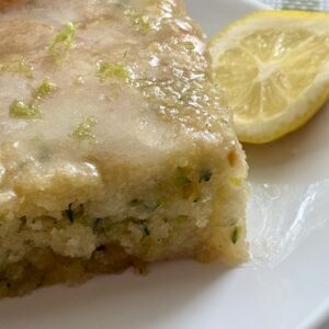 Glazed Lemon Zucchini cake on a plate