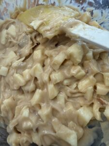 adding apples to the batter