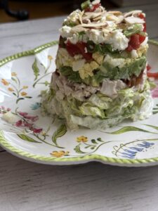 stacked Cobb salad on salad plate