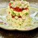 feature stacked Cobb salad on melamine plate