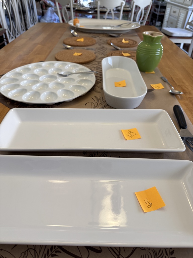 setting up a buffet with serving piece tags